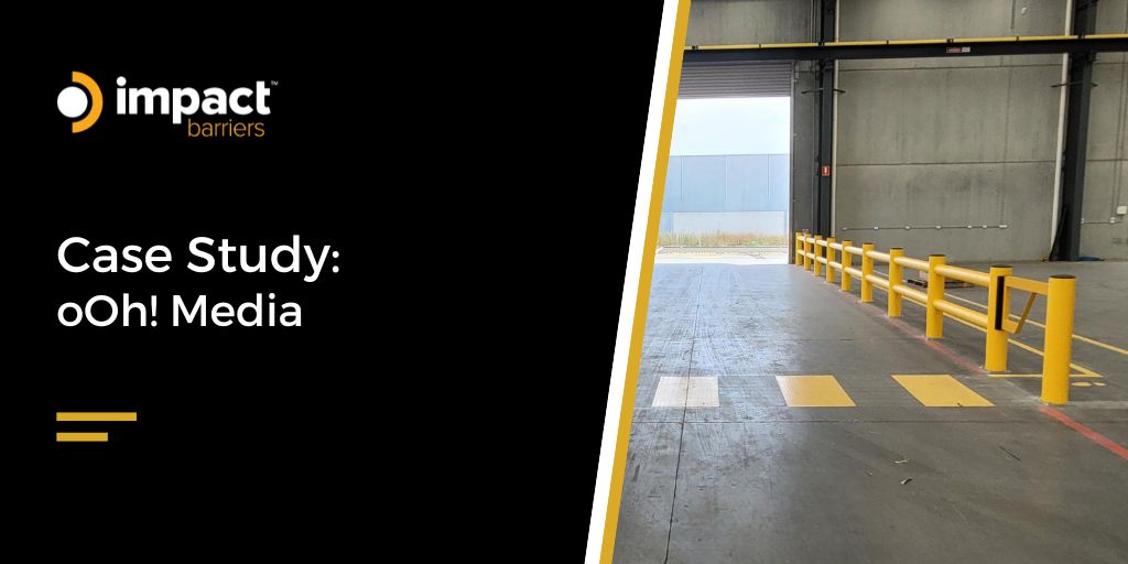 Bright yellow plastic or polymer safety barriers line the right side of the aisle leading outside. The concrete floor has yellow and white markings.